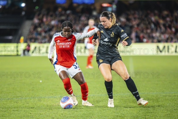 MELBOURNE, AUSTRALIA, MAY 24: Vivienne Lia of Arsenal Women FC competes against Michaela Foster of