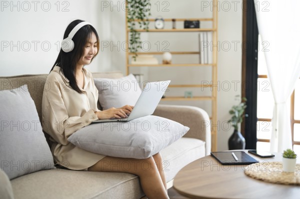 Start up Confident young asian business woman working in webcam group video call conference