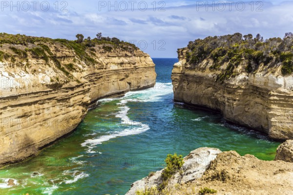 The Great Ocean Road of Australia. Coastal rocks are composed of sandstone. Small ocean fjord with