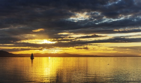 A Saisling Boat in Sunset at the City Lindau at the Lake Constance, Bavaria, Germany