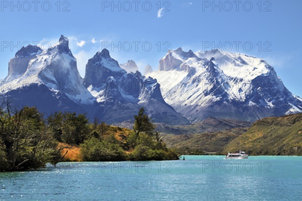 National Park Torres del Paine, Chile. Azure Lake Pehoe at the foot of the magnificent snow-covered