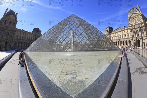 Paris, September 8: The world-famous entrance to the Louvre - the glass pyramid and a spectacular