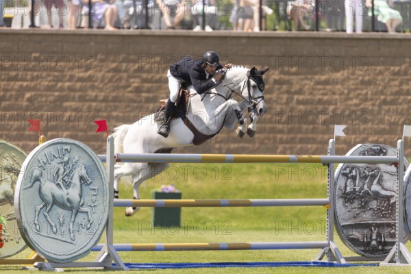 Eugenio Garza Perez of Mexico and riding Contago, compete in the 1.60m Grand Prix during The