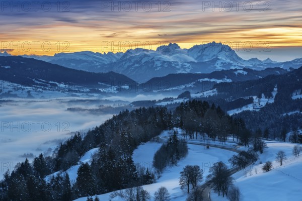 Dreamlike winter landscape at sunset with a view from the Allgäu Alps over the Bregenzerwald in
