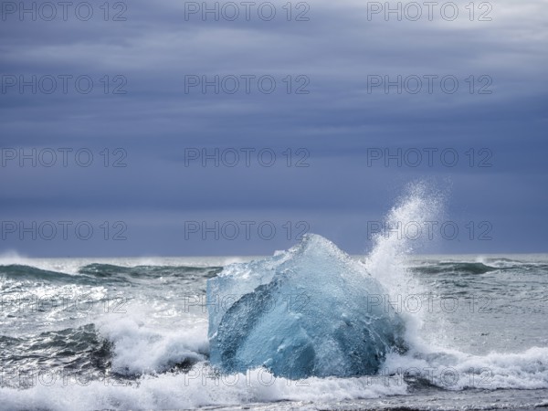 Diamond Beach, iceberg in the surf, near Jökulsarlon glacier lagoon, Vatnajökull National Park,