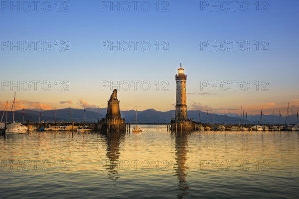 Harbour entrance of Lindau with lighthouse and sculpture of lion Lindau, Germany