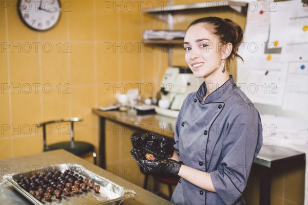 Subject profession and cooking pastry. young Caucasian woman with tattoo of pastry chef in kitchen