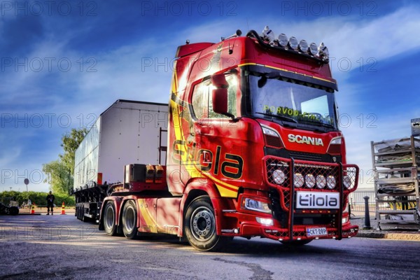 Red Next Generation Scania truck in front semi trailer of Eilola Logistics Oy, special transport.