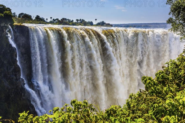 Journey after the wet season. Grand and deep Victoria Falls after the rainy season. Victoria