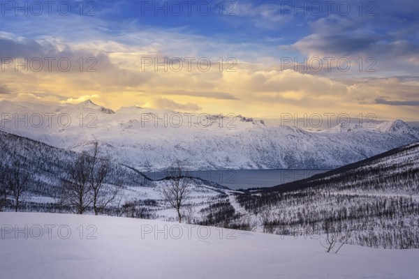 Beautiful winter landscape scene, sunset or sunrise in mountains and fjords