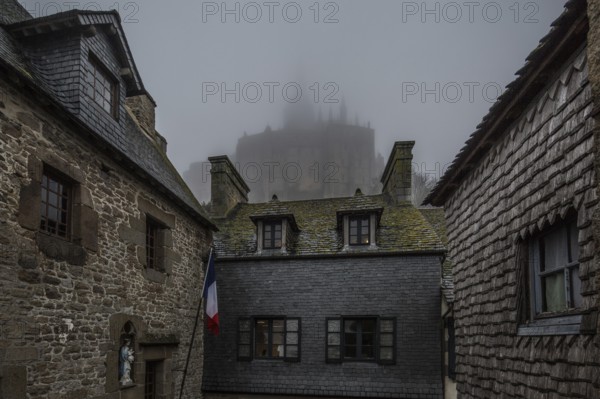 Mont-Saint-Michel, monastery hill, houses at the lower end of the Grande Rue above the abbey in the