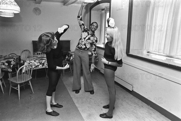 The pop group ABBA. Its two female members Anni-Frid Lyngstad and Agnetha Fältskog practice and