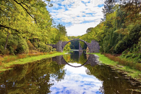 The Devil's Bridge on the Rakots River. Park Kromlau, Germany. The basalt columns of the bridge