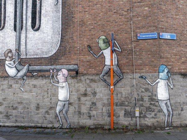 Large wall graffiti on the brick wall of buildings in Craenendonck Street, Leuven, Flemish Brabant