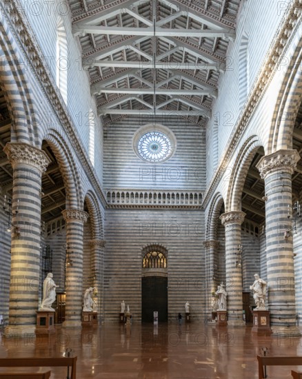 Orvieto, Italy, 18 November, 2023: interior view of the Orvieto Cathedral central nave with pews