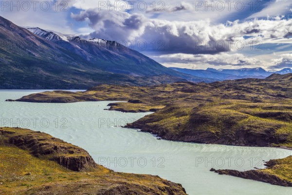 Azure lake Pehoe between rocks Los Kuernos. National Park Torres del Paine. Travel in Chile. The