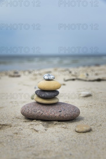 Round pebbles on the beach in Denmark is a symbol for harmony. Stones on the beach in Denmark is a