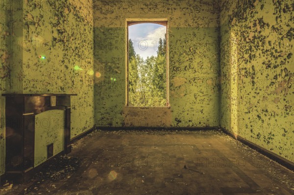 Abandoned room with shimmering green walls and a window overlooking trees, Prison H11, Lost Place,