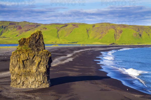 Cape Dyrholaey. Travel to the fabulous island of Iceland. Giant lonely rock - Palm on a black