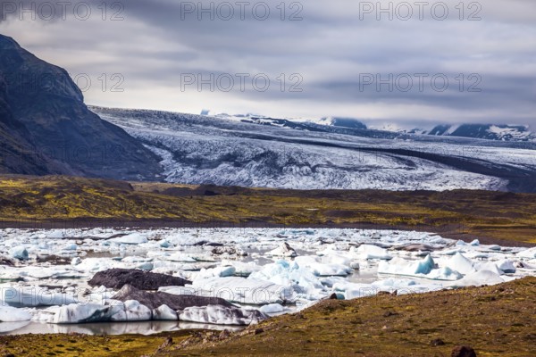 Sunrise in the Ice Lagoon. Drift ice Ice Lagoon - Jokulsarlon. Ice floes are reflected in the