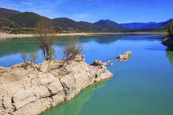 Picturesque backwater. Wonderful autumn day. The La Penia Reservoir collects the waters of the