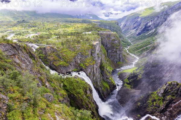 Voringsfossen is a majestic waterfall on the Hardangerfjord. The waterfall falls into a narrow deep