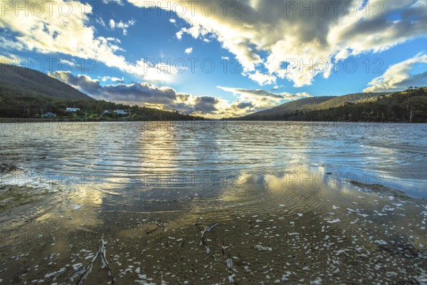 Wild landscapes with clouds reflected in the water, in Tasman Peninsula in South Eastern Tasmania,