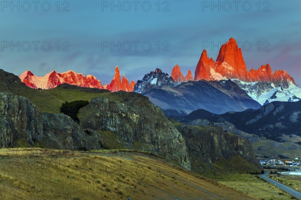 The grand crimson dawn over the mountain range Fitzroy. Mountain peak in Patagonia in the border