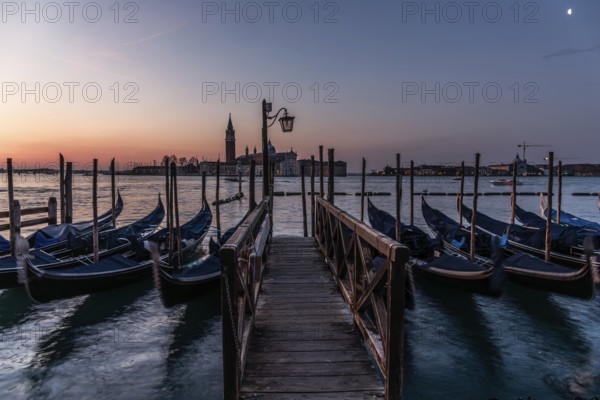 Dawn, Venetian gondolas with the church of San Giorgio Maggiore in the background, Venice, UNESCO