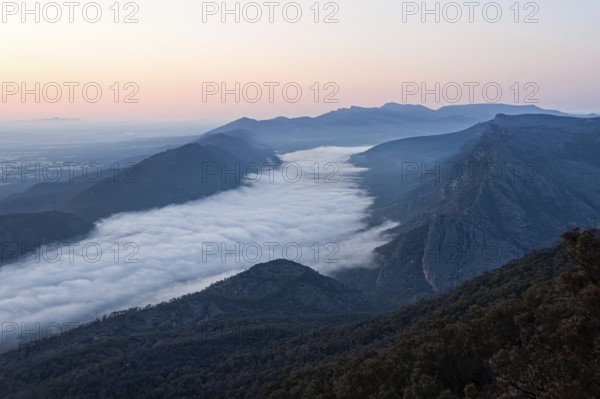 Clouds in the valley and the Wonderland Range at sunrise photographed from the Boroka Lookout in