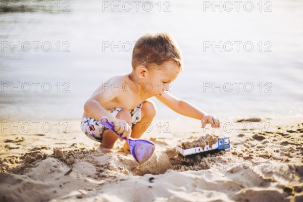 Kids Play On Beach. Sand And Water Toy. Truck toy car with sand and soil. green environment