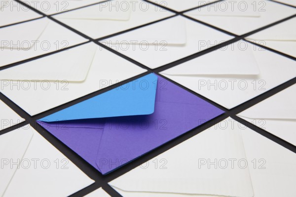 Composition with white and colored envelopes on the table. The photo suitable for various holidays