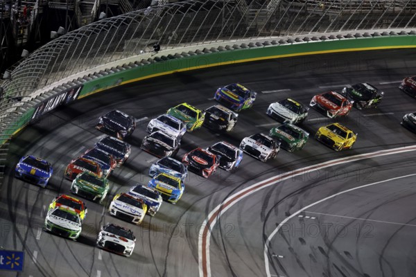 NASCAR Cup Driver, AJ Allmendinger (16) races off turn four during the Quaker State 400 Available