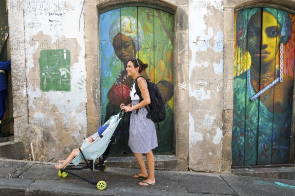 Tourist walking in the colorful historic district of Pelourinho, Bahia, Brazil. Historic