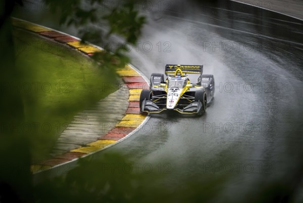 COLTON HERTA (26) of Valencia, California comes through turn 12 (Canada Corner) during a wet