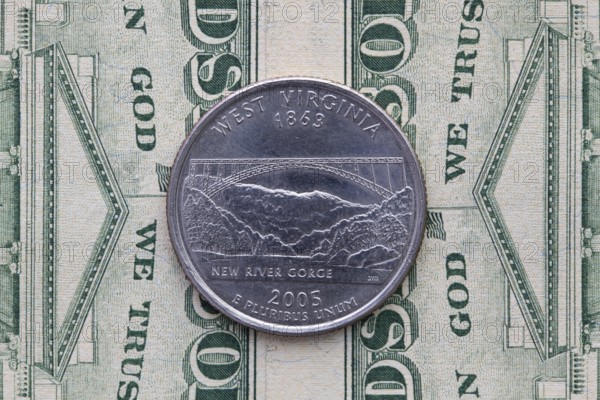 A quarter of West Virginia on US dollar bills. Symmetric composition of US dollar bills and a