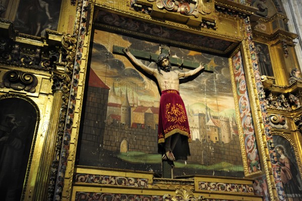 Crucifix in front of a painting in the cathedral, historic city centre, UNESCO World Heritage Site,