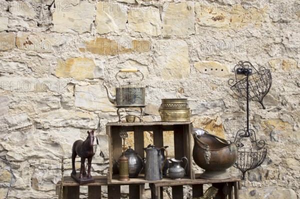 Still life in front of a natural stone wall