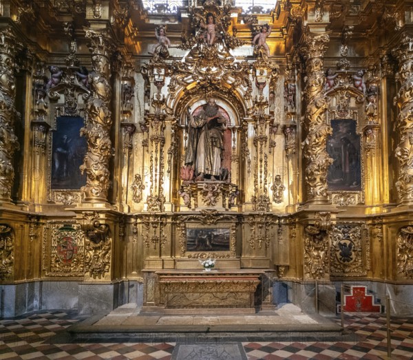 Segovia, Spain, 7 April, 2024: detail view of a gilded altar piece in a side chapel of the Segovia