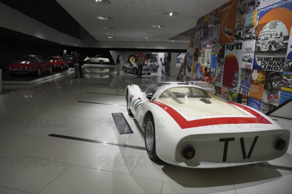 Porsche 906 Carerra 6, white racing car with red stripes, embedded in a colourful historical