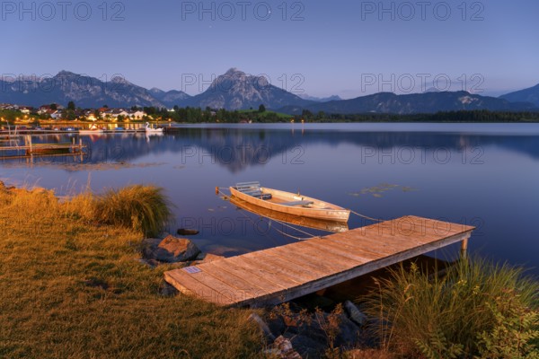 Wooden footbridge at Lake Hopfensee with the Allgäu Alps in the background, Allgäu, Swabia,
