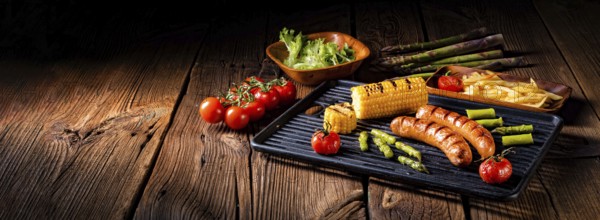 Grilled krakauer with french fries and green salad
