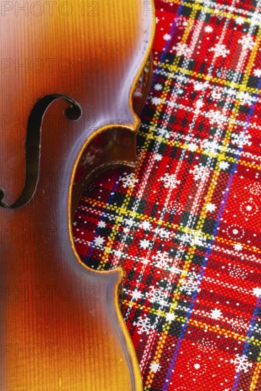Photo of old violin on Christmas decoration. Winter holidays. Merry christmas and happy new year