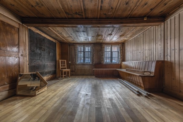 The living room with wooden corner bench in a house built around 1750 that has since been