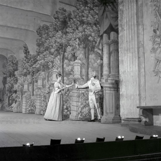 As if in the 18th century. Actors Jarl Kulle and Maj-Britt Nilsson in a scene taken inside the