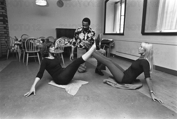 The pop group ABBA. Its two female members Anni-Frid Lyngstad and Agnetha Fältskog practice and