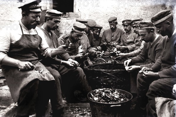 German soldiers on kitchen duty. First World War, France. German soldiers during kitchen duty.