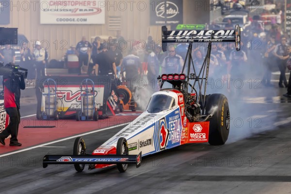 NHRA driver, Antron Brown, prepares to qualify for the Dodge Power Brokers NHRA Mile-High Nationals
