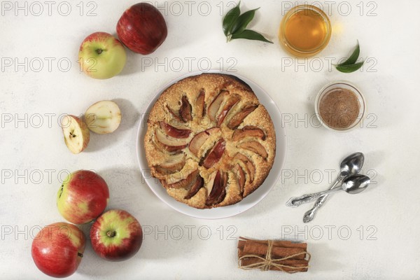 Kitchen background with apple pie, honey, apples, spices, cozy warm concept, hello autumn, hygge