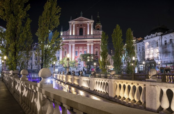 Famous Three Bridges and the Preseren square in the center of Ljubljana illuminated at night,